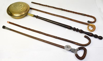 Lot 667 - Three walking sticks, to include an example...