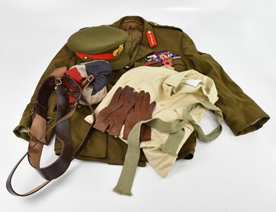 Lot 1672 - A collection of militaria including a uniform,...