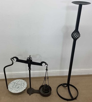 Lot 179 - A wrought iron candle holder, 130 x base...