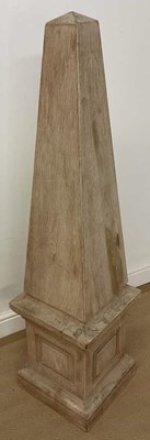 Lot 41 - A light pine obelisk ornament, 140 x 33 x 33cm.