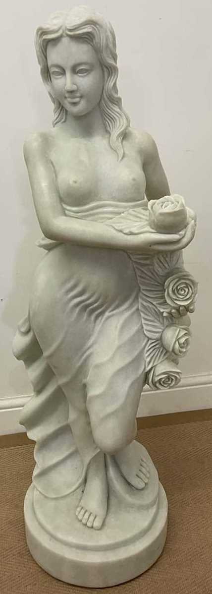 Lot 668 - A marble statue of a scantily clad woman...