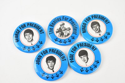 Lot 2057 - THE BEATLES; five vintage pin badges, stating...