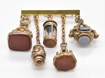Lot 482 - A 9ct yellow gold bar brooch set with five...
