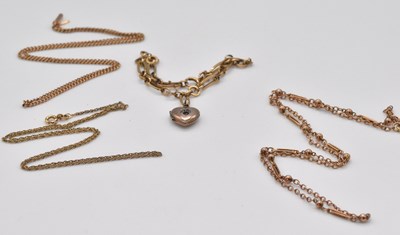 Lot 476 - Three yellow metal chains and a yellow metal...