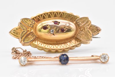 Lot 480 - A yellow metal sapphire and diamond three...