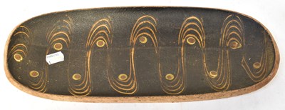 Lot 195 - A studio pottery oval dish with sgrafitto wavy...