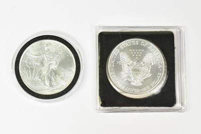 Lot 1194 - Two United States silver eagles, 1994 and 1995,...