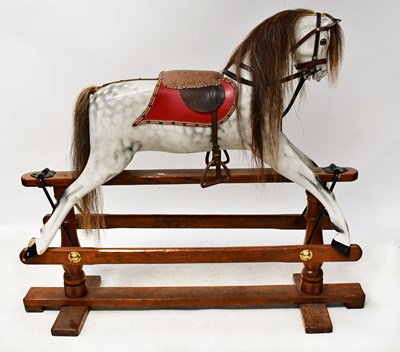 Lot 461 - A dapple grey rocking horse, with horsehair...