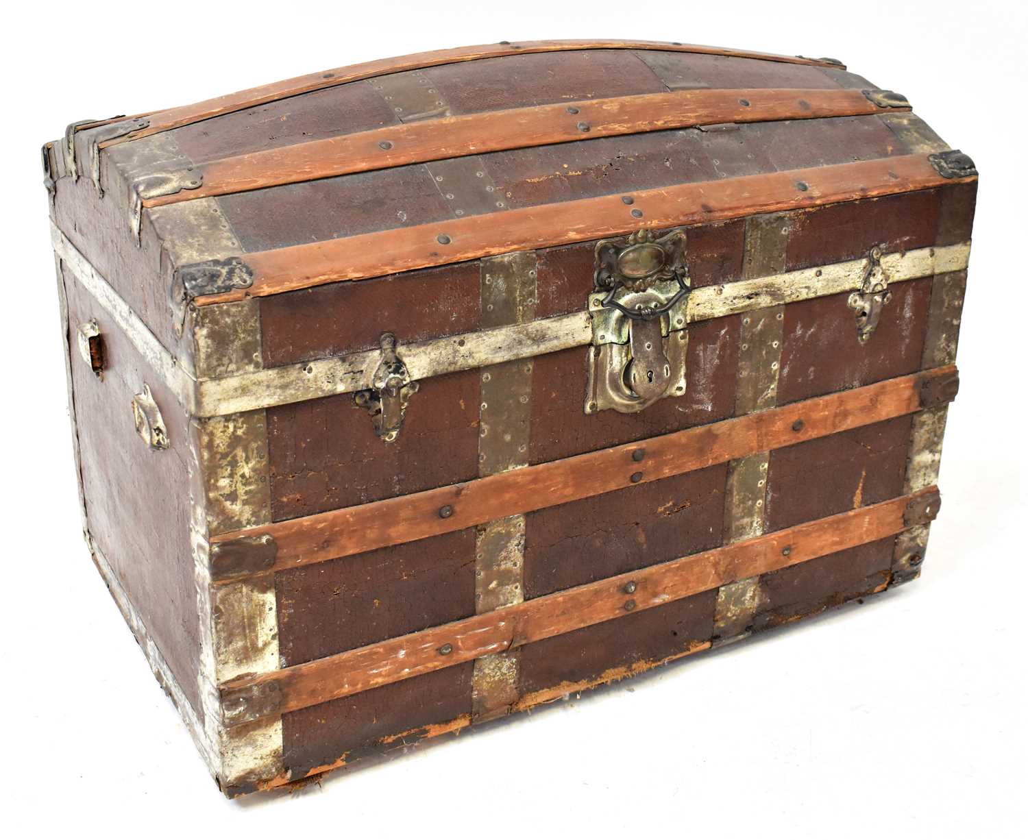Lot 29 - A vintage leather-covered domed travel trunk...