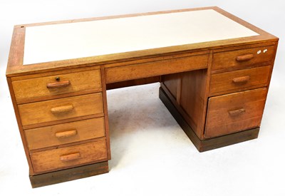 Lot 45 - A 1930s oak desk with an arrangement of eight...