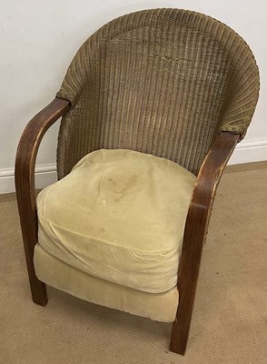 Lot 716 - LLOYD LOOM; a tub chair, with design plaque to...