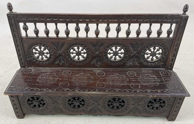 Lot 705 - A late Victorian carved oak candle box with...