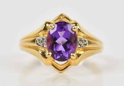 Lot 396 - A yellow metal amethyst and diamond set three...