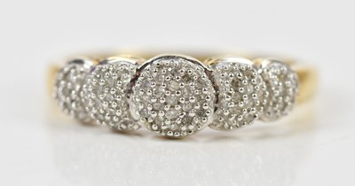 Lot 436 - A yellow metal dress ring set with a melee of...