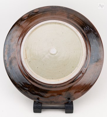Lot 19 - ANDREW CROUCH (born 1955); a stoneware charger...
