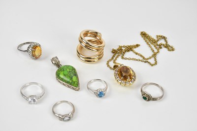 Lot 112 - A white metal dress ring, stamped '375', set...