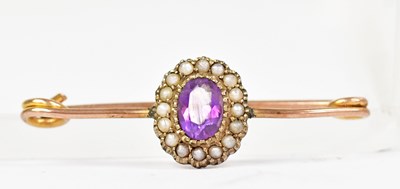 Lot 1399 - A 9ct yellow gold brooch with amethyst and...