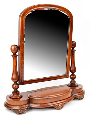 Lot 65 - A Victorian mahogany swing-framed mirror, the...