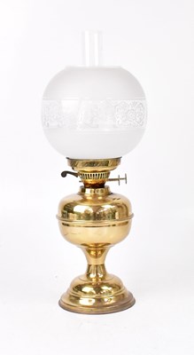 Lot 73 - A brass oil lamp with burner, chimney and...
