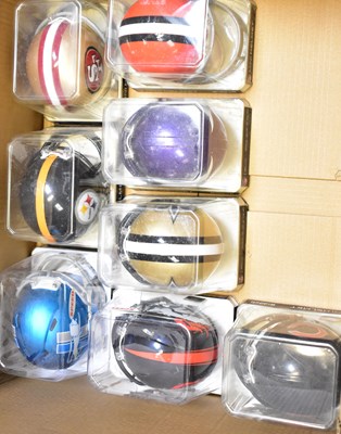 Lot 542 - NFL; twenty-eight mini-helmets from various...