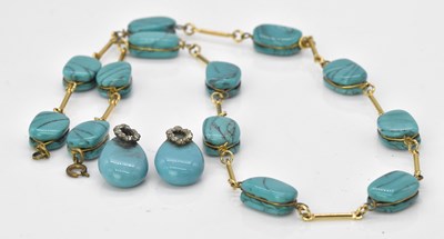 Lot 512 - An unusual turquoise bead and yellow metal...