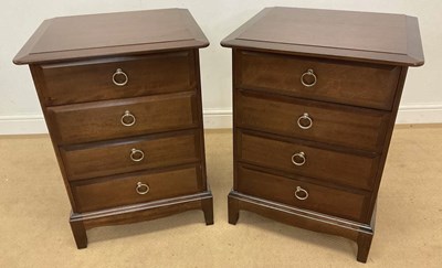 Lot 721 - STAG; a pair of mahogany Minstrel bedside...