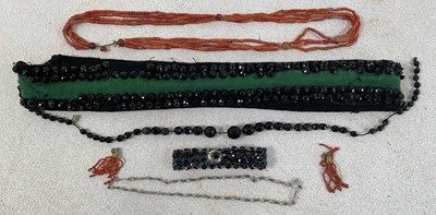Lot 545 - A small group of French jet, a strung coral...