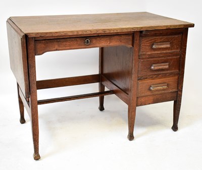Lot 21 - An early 20th century oak single pedestal desk...