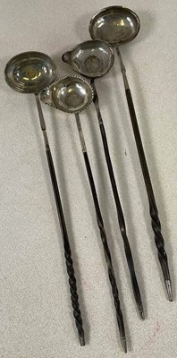 Lot 430 - Four 18th century silver toddy ladles, each...