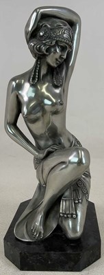 Lot 252 - An Art Deco inspired silvered metal figure of...