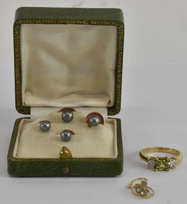 Lot 1273 - A yellow metal white and green stone set ring,...