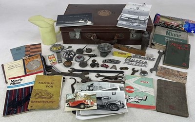 Lot 169 - A leather suitcase containing a small amount...