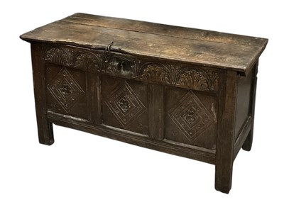 Lot 33 - An 18th century carved oak plank top coffer of...
