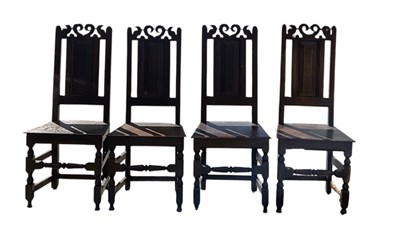 Lot 34 - A set of four 18th century oak hall chairs,...