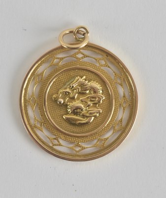 Lot 1391 - A Chinese 14K gold pendant, the front...