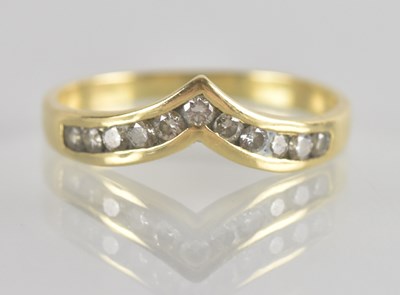 Lot 1326 - An 18ct gold ring in the form of a wishbone,...