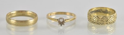 Lot 1274 - Three 9ct gold rings comprising two band rings,...