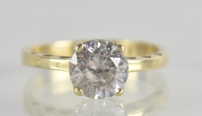 Lot 1327 - An 18ct gold white stone claw set ring, size P,...
