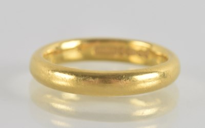 Lot 1238 - A 22ct gold band ring, size K, approz 5.26g.