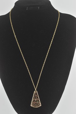 Lot 1378 - A 9ct gold gem set pendant of triangular shape,...