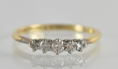 Lot 1275 - An 18ct gold diamond set ring, the head with...