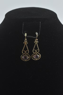 Lot 1454 - A pair of Edwardian style drop earrings, with...
