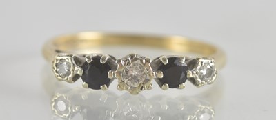 Lot 1284 - A 9ct gold diamond and sapphire set ring, the...