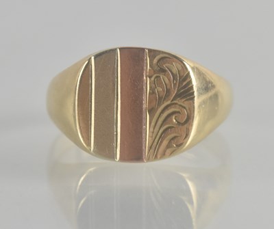 Lot 1330 - A 9ct gold signet ring with three bands...