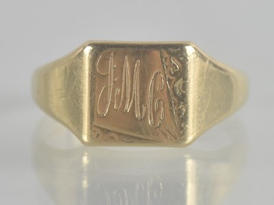 Lot 1331 - A 9ct gold signet ring with worn initials to...