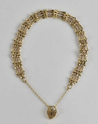 Lot 1521 - A 9ct gold four bar dainty gate link bracelet,...