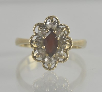 Lot 1338 - A vintage 9ct gold dress ring in a floral...