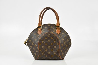 Lot 658 - LOUIS VUITTON; a monogram coated canvas...