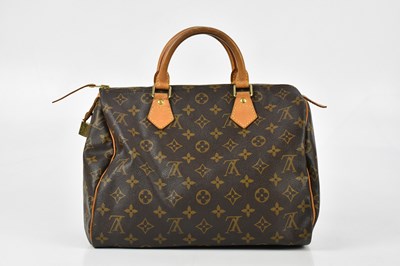 Lot 657 - LOUIS VUITTON; a brown coated canvas monogram '...