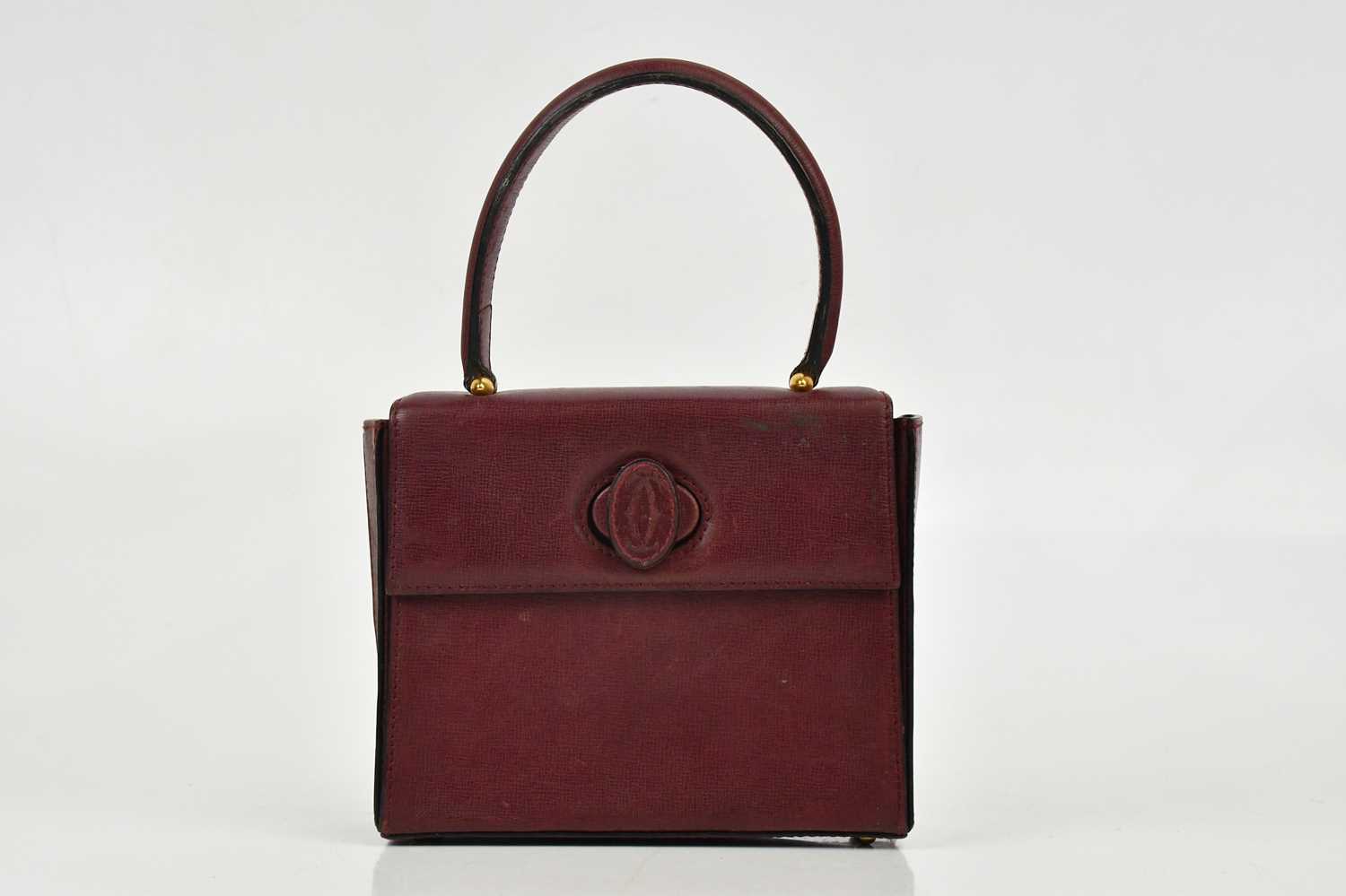 Lot 680 - CARTIER; a Must de Cartier 2C logo red